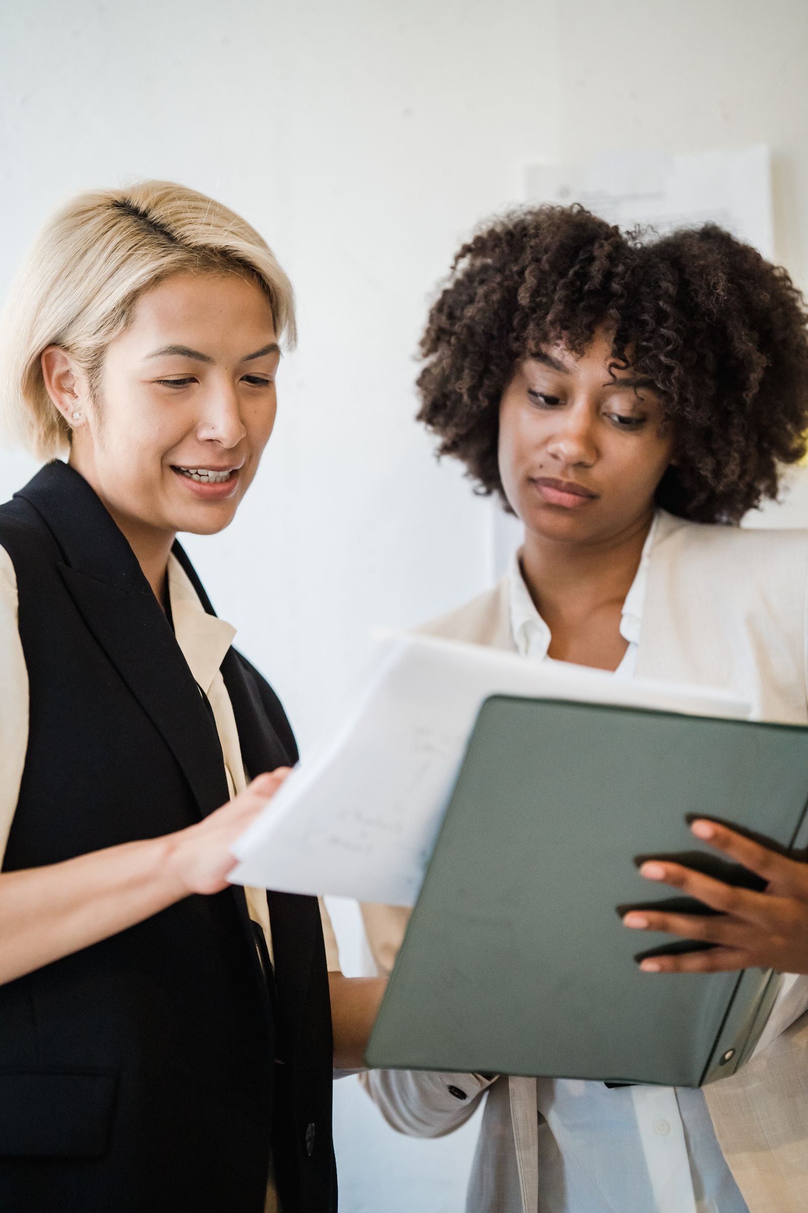Two professionals reviewing documents together