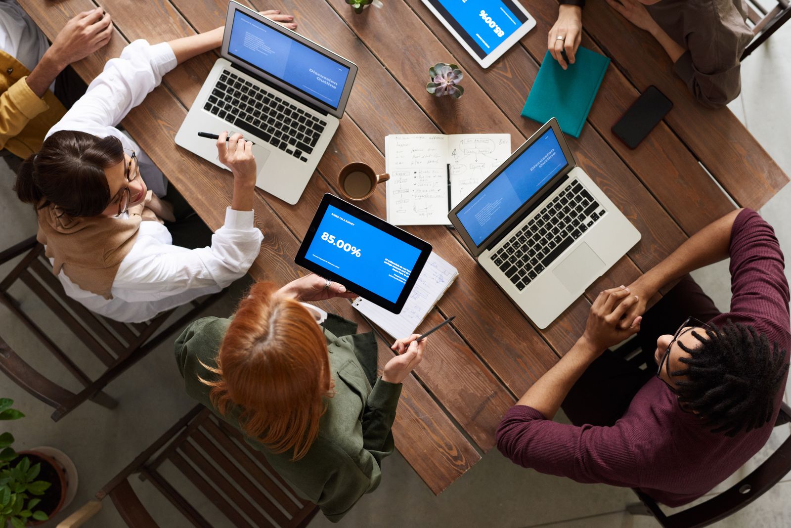 A team working through questions together around a table