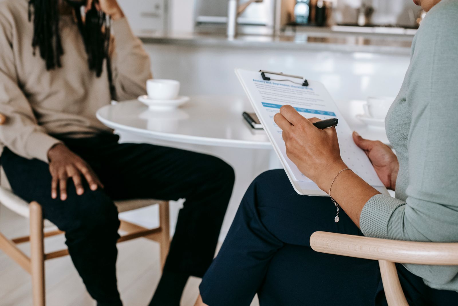 Reviewing an intake checklist on a clipboard with a client